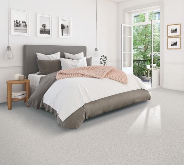 beige carpet in modern, bright bedroom