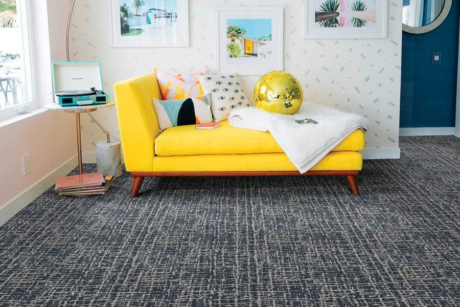 yellow couch on a gray carpet from Stoller Floors in Orrville, OH