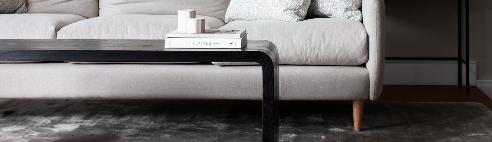 white couch and black coffee table on a brown hardwood floor from Stoller Floors in Orrville, OH